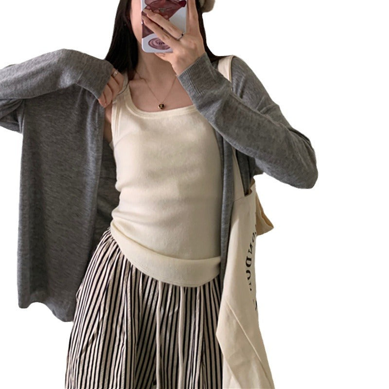 Kvinnors avslappnade stickad cardigan med lös passform och fina detaljer Mirla-Eva Jonsson