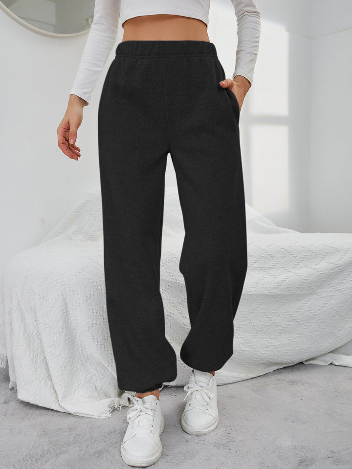 Kvinnors avslappnade sweatpants med elastisk midja och sidofickor Mirla-Eva Jonsson