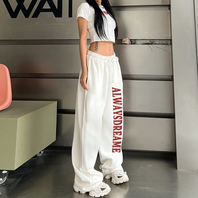 Kvinnors avslappnade sweatpants med motiverande text och elastisk midjeband Mirla-Eva Jonsson