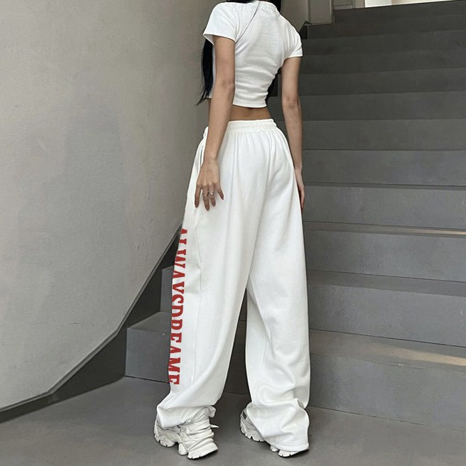 Kvinnors avslappnade sweatpants med motiverande text och elastisk midjeband Mirla-Eva Jonsson