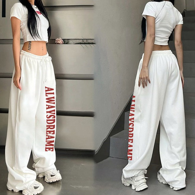 Kvinnors avslappnade sweatpants med motiverande text och elastisk midjeband Mirla-Eva Jonsson