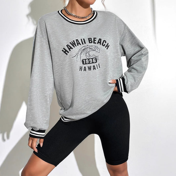 Kvinnors avslappnade sweatshirt med tryckt Hawaii-motiv och sänkta axlar Mirla-Eva Jonsson
