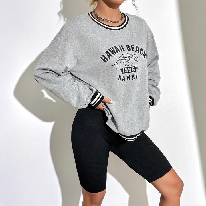 Kvinnors avslappnade sweatshirt med tryckt Hawaii-motiv och sänkta axlar Mirla-Eva Jonsson