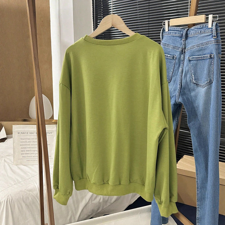 Kvinnors avslappnade sweatshirts med iögonfallande tryck Mirla-Eva Jonsson