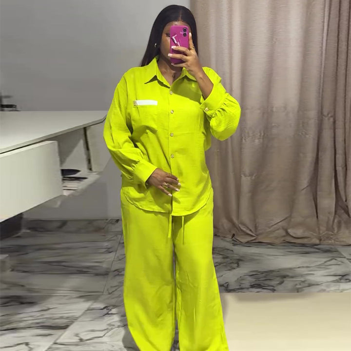 Kvinnors avslappnade tvådelat set med långärmad blus och vida byxor-Eva Jonsson