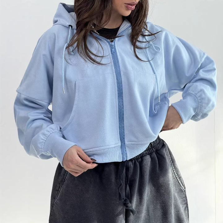 Kvinnors avslappnade zip hoodie med vida ärmar och praktiska fickor-Eva Jonsson