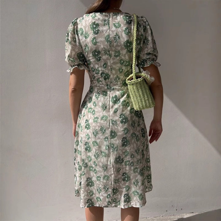 Kvinnors blommig klänning med samlade ärmar och sidoslits Mirla-Eva Jonsson