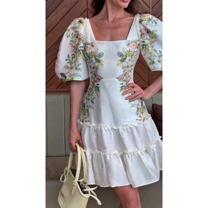 Kvinnors blommig klänning med voluminösa puffärmar och flödande kjol Mirla-Eva Jonsson