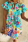 Kvinnors blommig kortärmad klänning med lekfulla broderier och rund ringning-Eva Jonsson