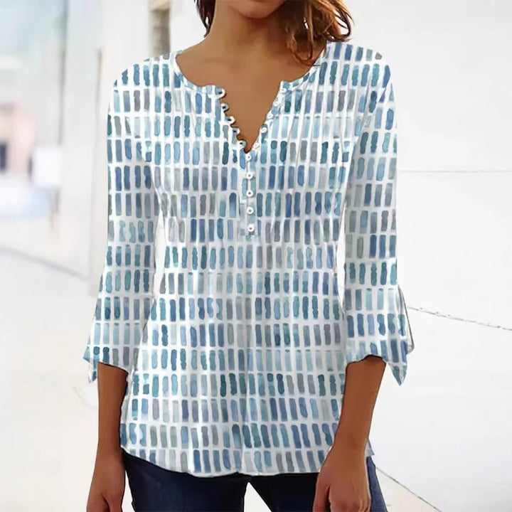 Kvinnors blus i modern grafisk design med knappp detaljer Mirla-Eva Jonsson