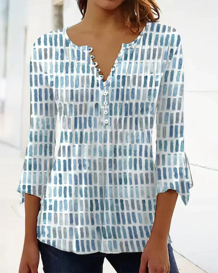 Kvinnors blus i modern grafisk design med knappp detaljer Mirla-Eva Jonsson