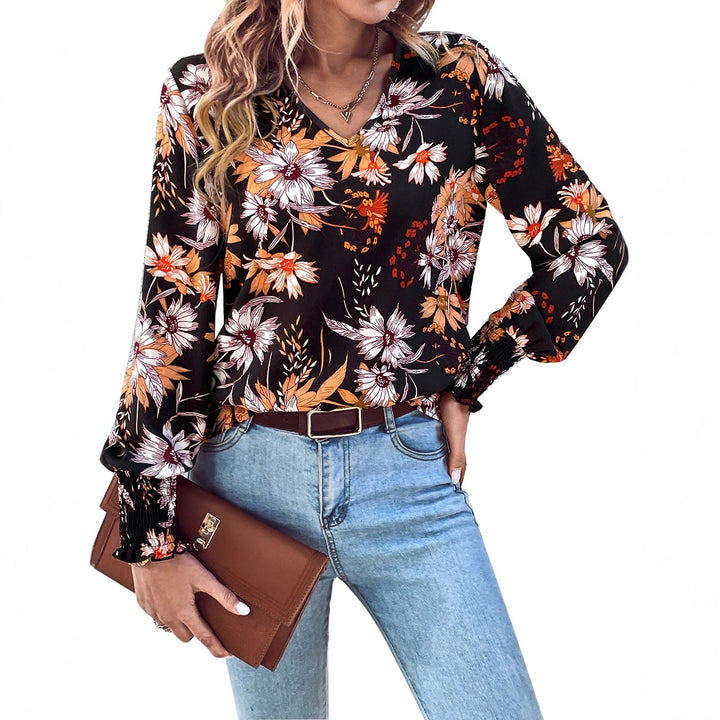 Kvinnors blus med blommönster och elastiska volangdetaljer Mirla-Eva Jonsson