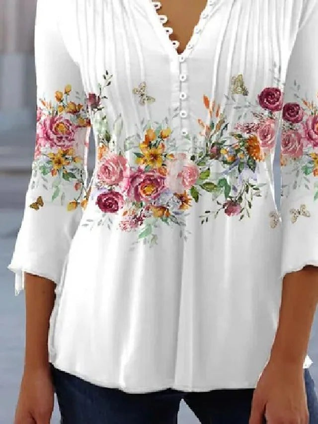 Kvinnors blus med blommönster och knappringning Mirla-Eva Jonsson