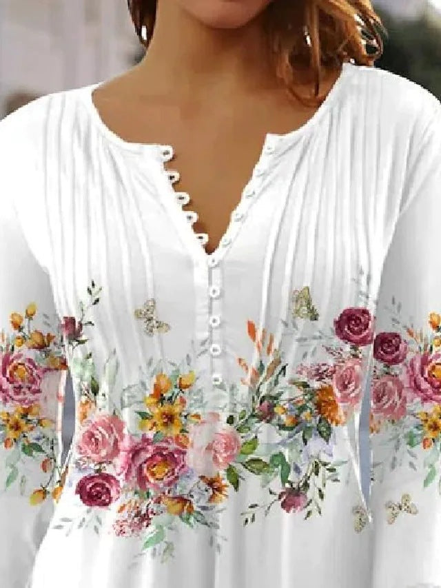 Kvinnors blus med blommönster och knappringning Mirla-Eva Jonsson