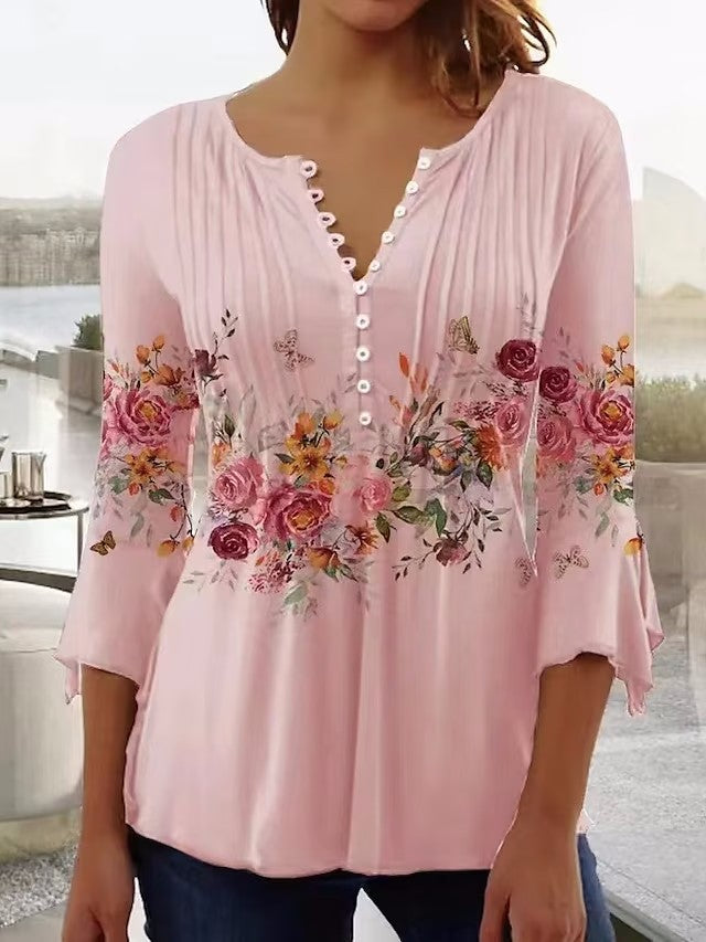 Kvinnors blus med blommönster och knappringning Mirla-Eva Jonsson