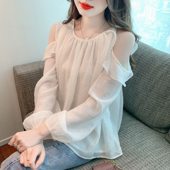 Kvinnors blus med off-shoulder design och volangdetaljer Mirla-Eva Jonsson