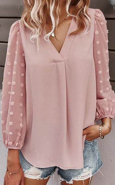 Kvinnors blus med transparenta puffärmar och prickig detalj Mirla-Eva Jonsson