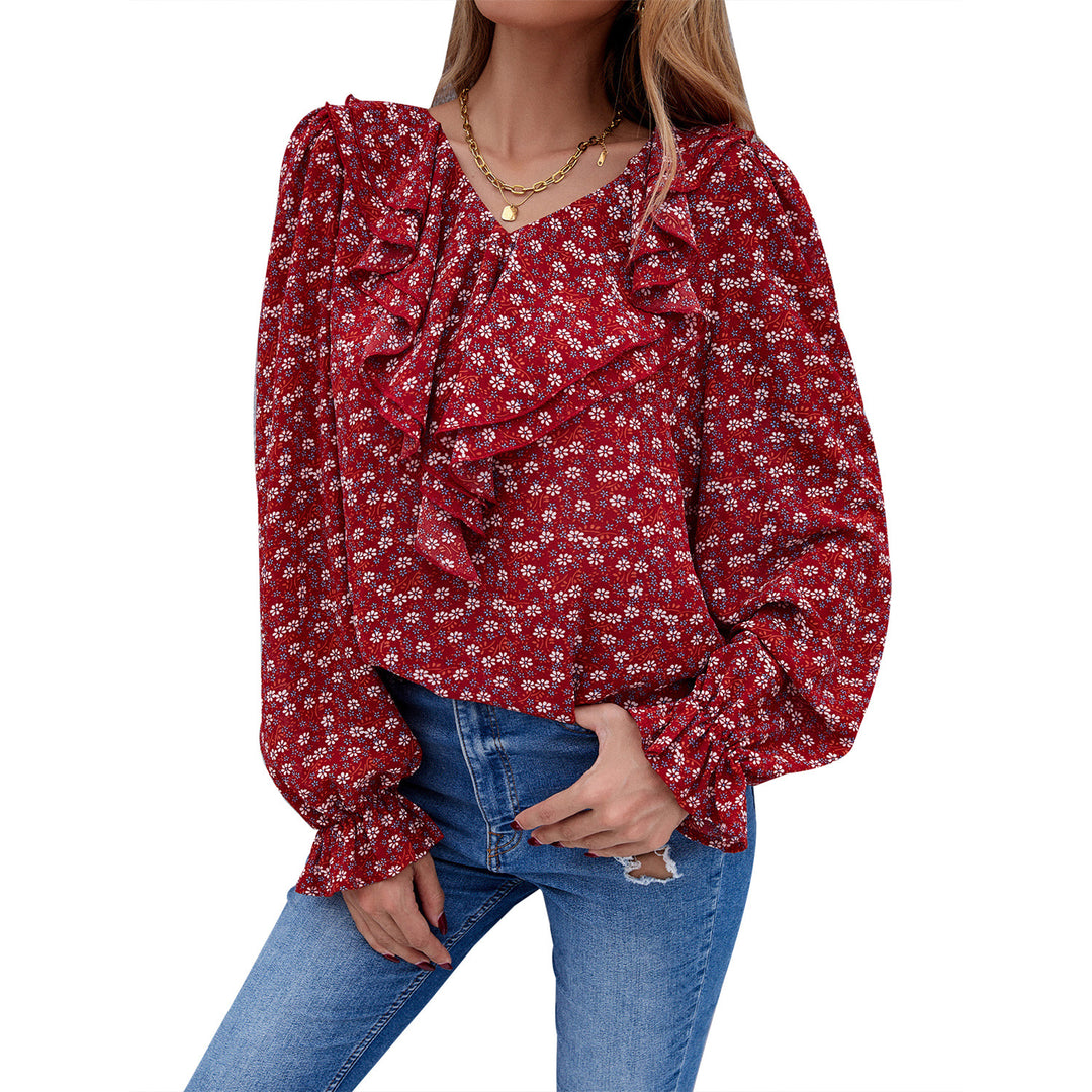Kvinnors blus med volangdetaljer och blommönster Mirla-Eva Jonsson