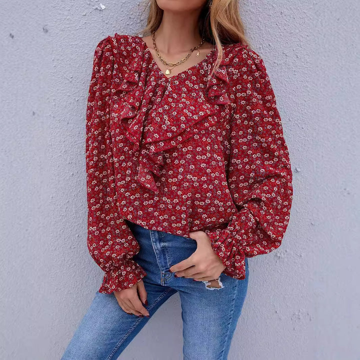 Kvinnors blus med volangdetaljer och blommönster Mirla-Eva Jonsson