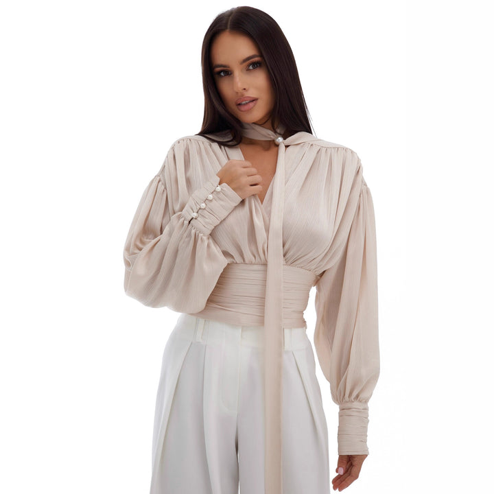 Kvinnors blus med voluminösa ärmar och eleganta pärlknappar Mirla-Eva Jonsson
