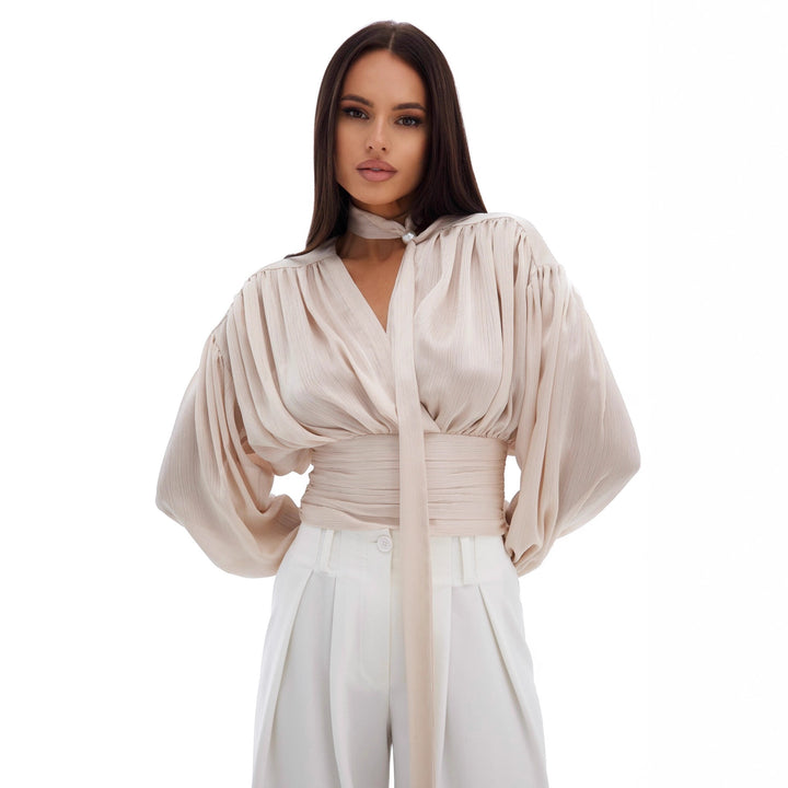 Kvinnors blus med voluminösa ärmar och eleganta pärlknappar Mirla-Eva Jonsson