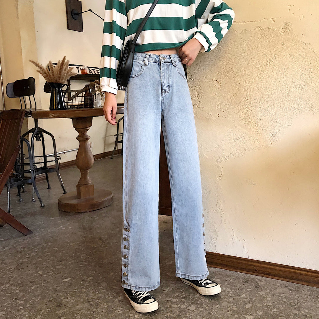 Kvinnors breda jeans med dekorativa knappp detaljer Mirla-Eva Jonsson