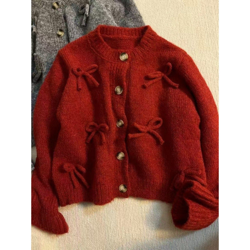 Kvinnors cardigan med dekorativa rosetter på-Eva Jonsson