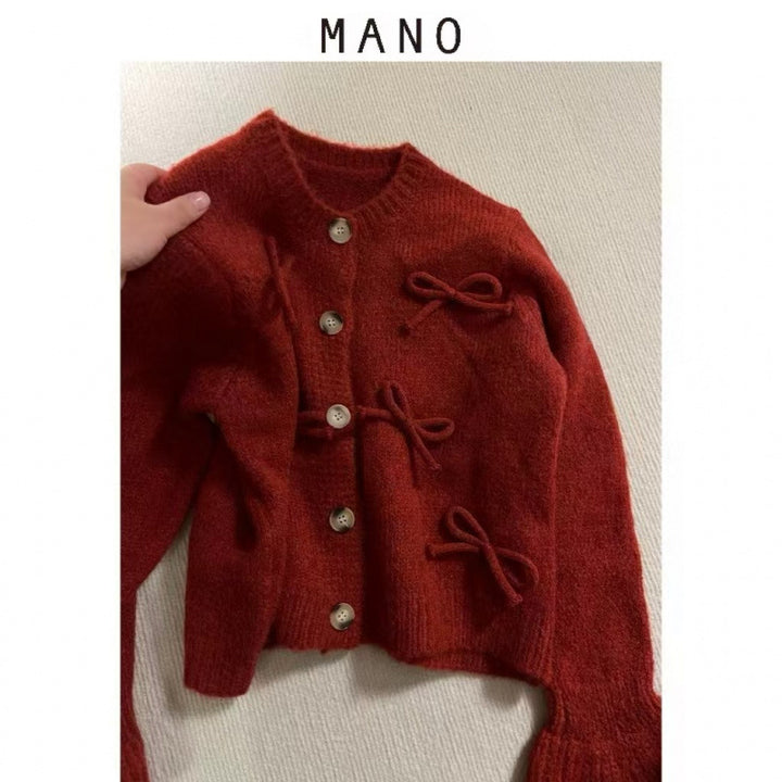 Kvinnors cardigan med dekorativa rosetter på-Eva Jonsson