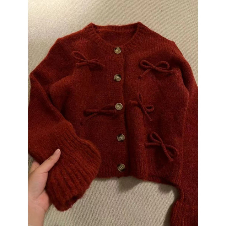 Kvinnors cardigan med dekorativa rosetter på-Eva Jonsson