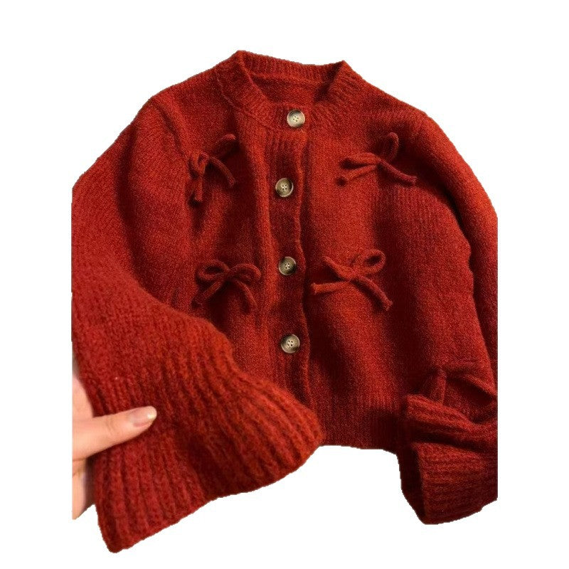 Kvinnors cardigan med dekorativa rosetter på-Eva Jonsson
