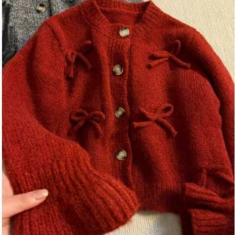 Kvinnors cardigan med dekorativa rosetter på-Eva Jonsson