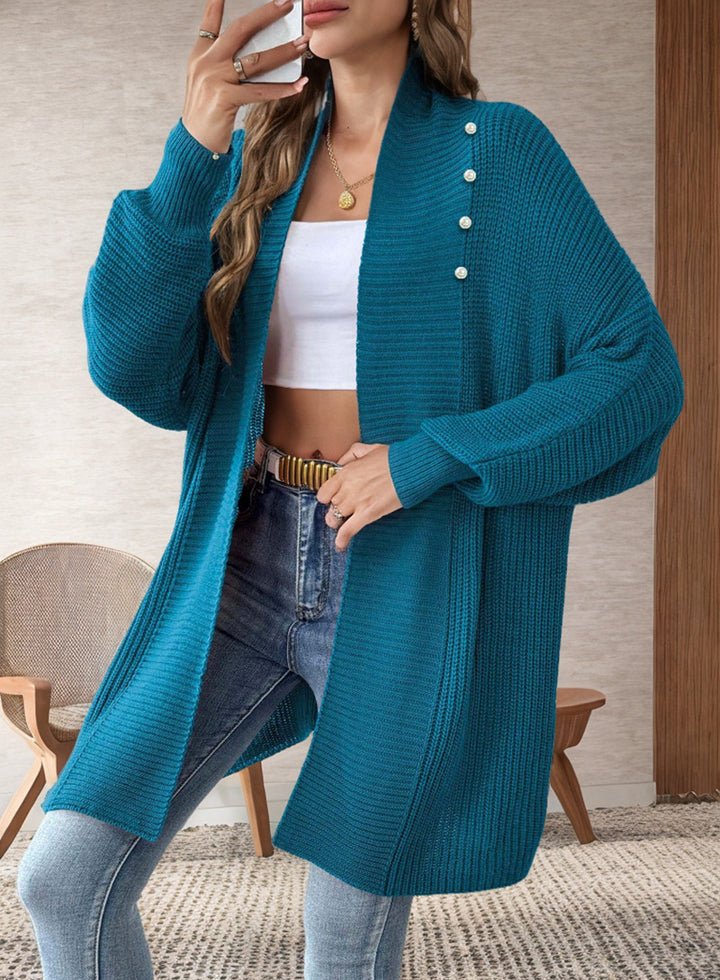 Kvinnors cardigan med pärlknappade knappar och elegant design Mirla-Eva Jonsson