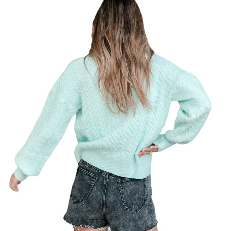 Kvinnors cardigan med texturerad kabelmönster och voluminösa ärmar Mirla-Eva Jonsson