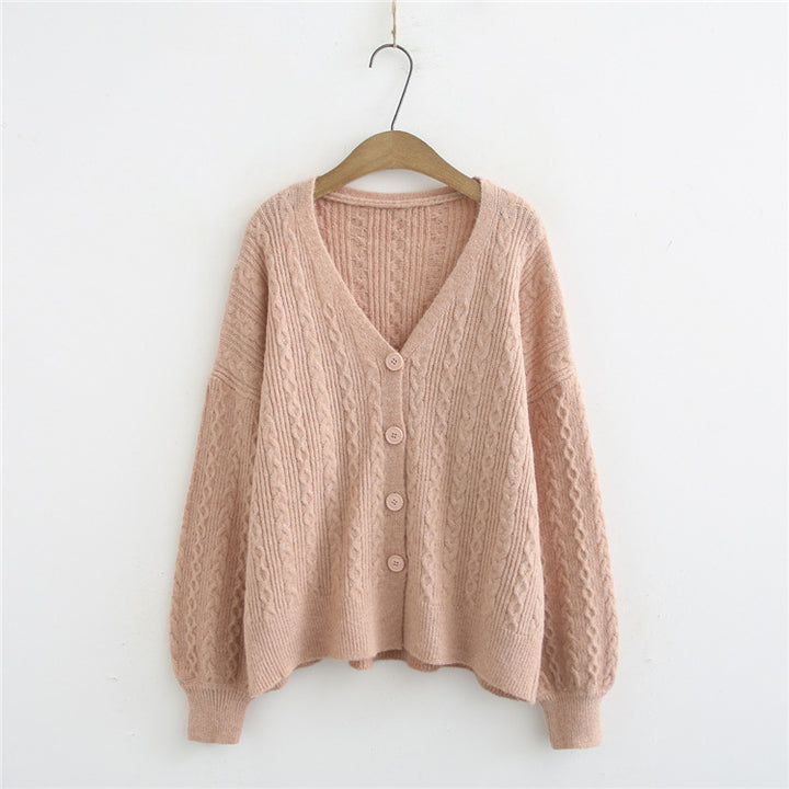Kvinnors cardigan med texturerad kabelmönster och voluminösa ärmar Mirla-Eva Jonsson