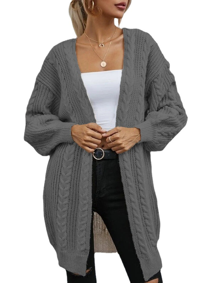 Kvinnors chunky stickad cardigan med dekorativt kabelmönster och avslappnad passform Mirla-Eva Jonsson