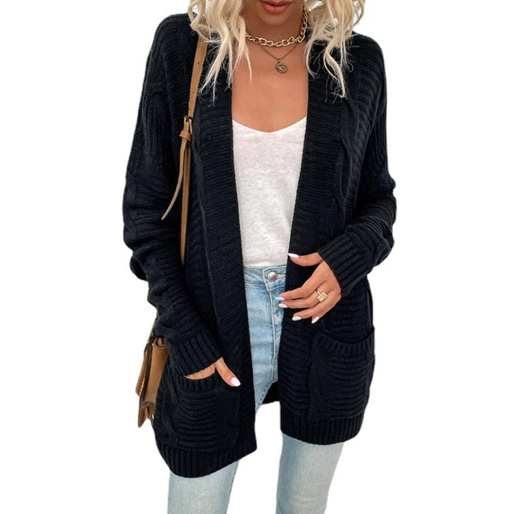 Kvinnors chunky stickad cardigan med fickor och öppen frontdesign Mirla-Eva Jonsson