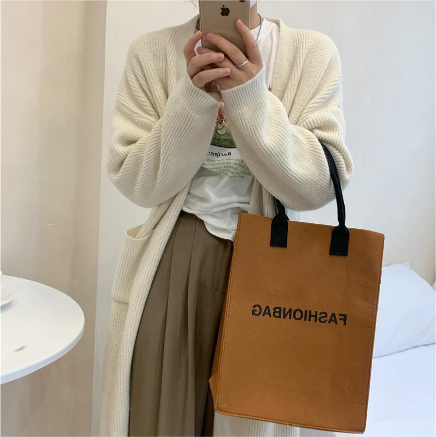 Kvinnors chunky stickad cardigan med fickor och trendig skärning Mirla-Eva Jonsson