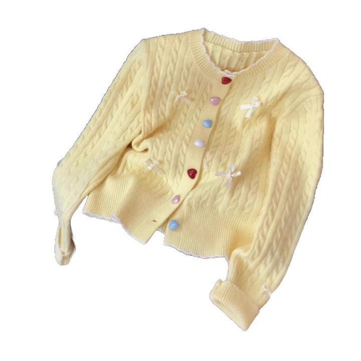 Kvinnors chunky stickad cardigan med lekfulla knapppdetaljer och rosetter-Eva Jonsson