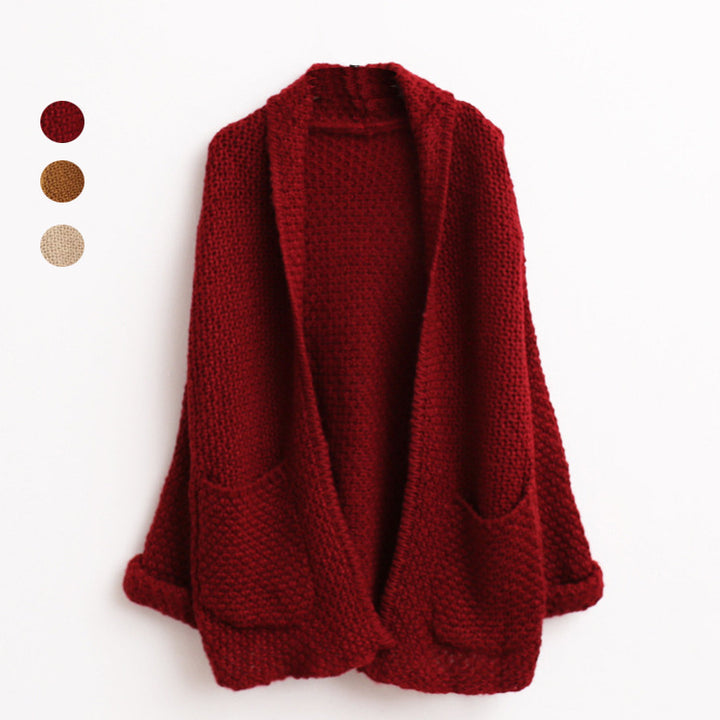 Kvinnors chunky stickad cardigan med råa kanter och praktiska fickor Mirla-Eva Jonsson