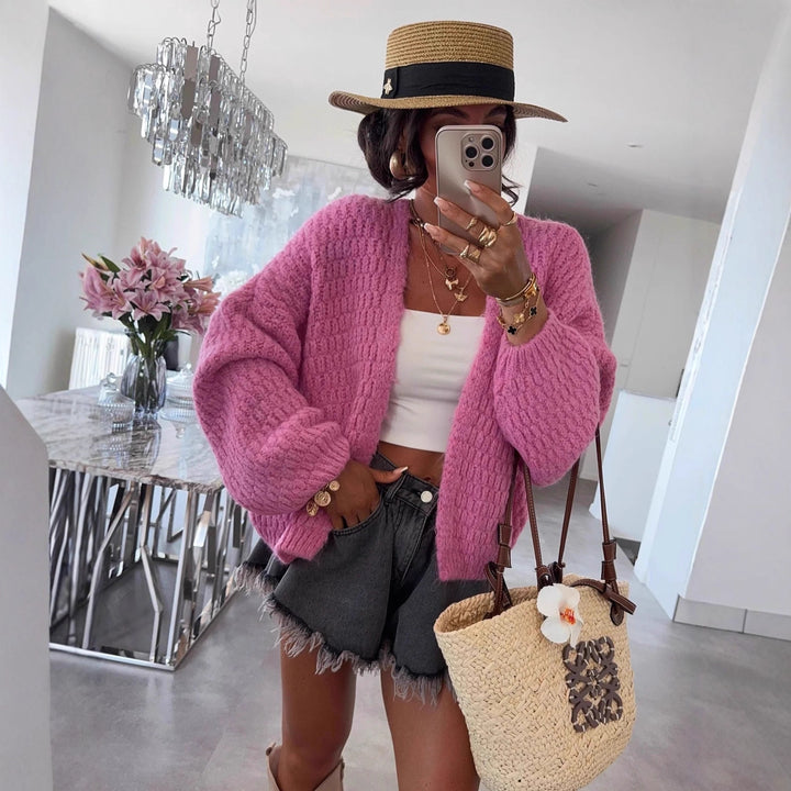 Kvinnors chunky stickad cardigan med voluminösa ärmar och öppen front Mirla-Eva Jonsson