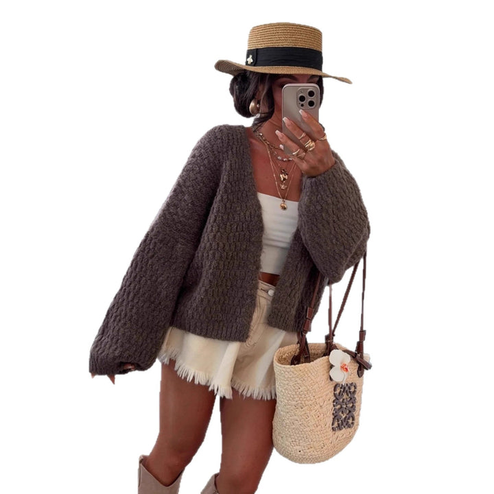 Kvinnors chunky stickad cardigan med voluminösa ärmar och öppen front Mirla-Eva Jonsson