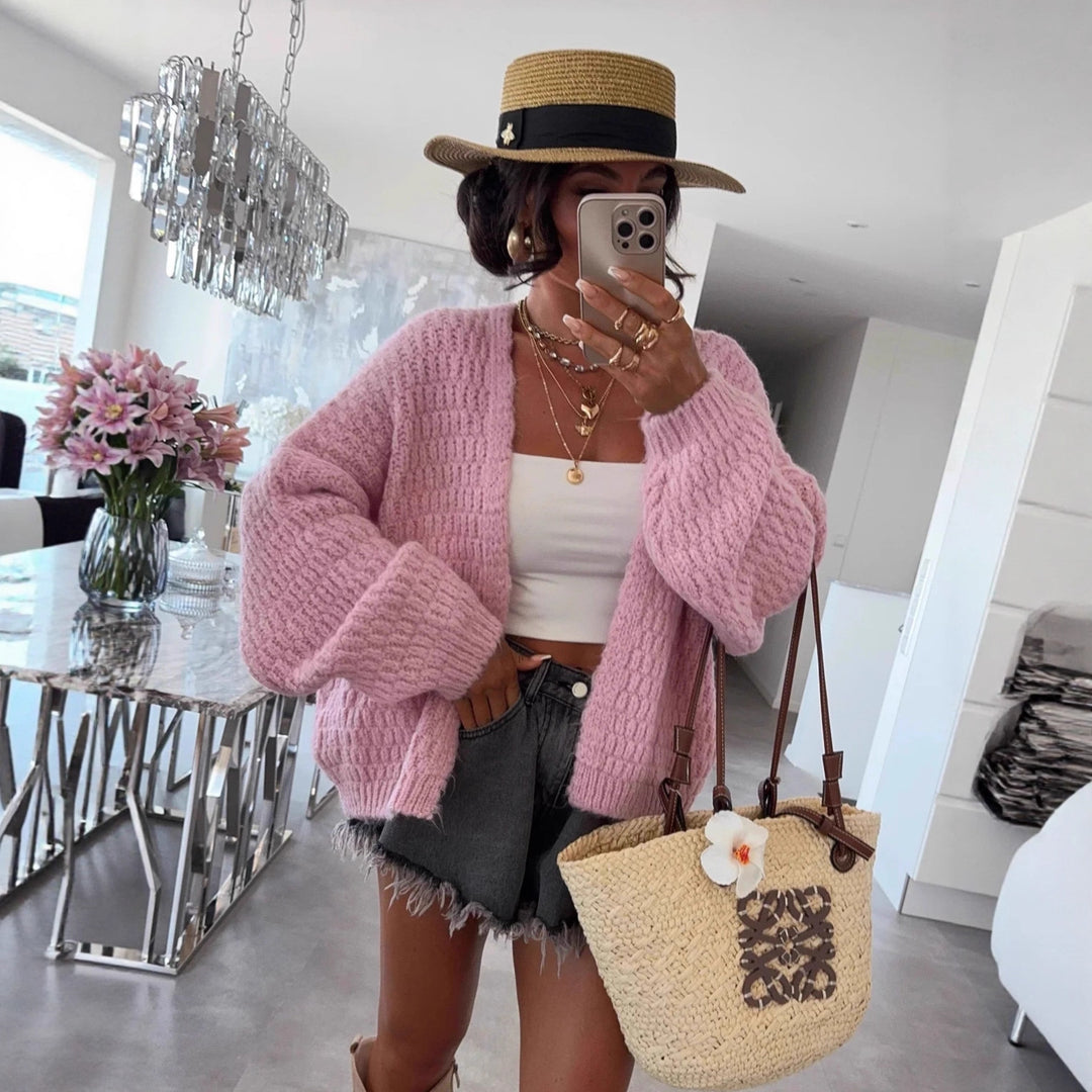 Kvinnors chunky stickad cardigan med voluminösa ärmar och öppen front Mirla-Eva Jonsson