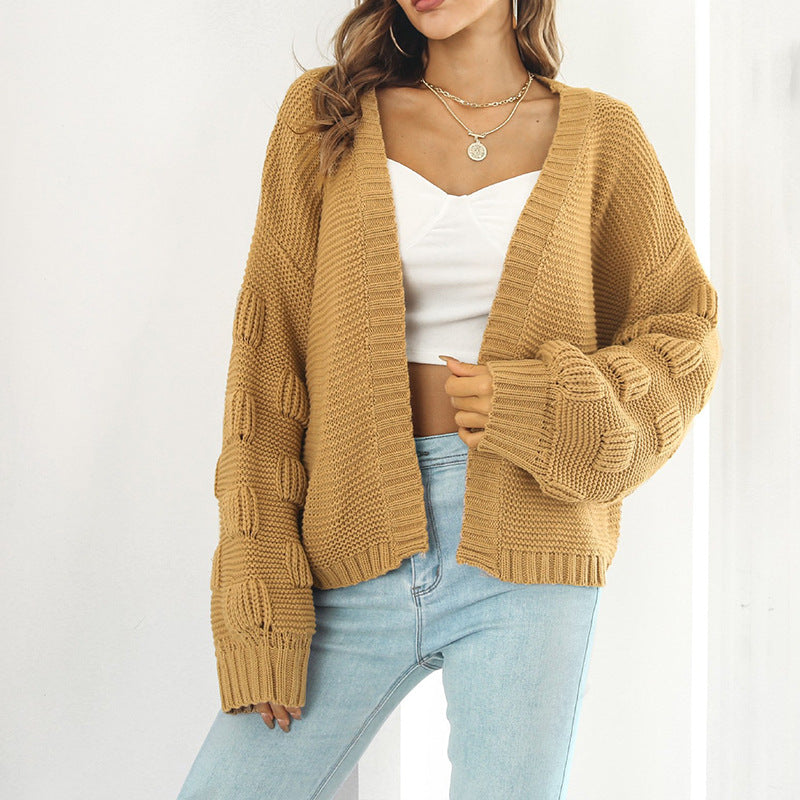 Kvinnors chunky stickad cardigan med voluminösa ärmar och öppen front Mirla-Eva Jonsson