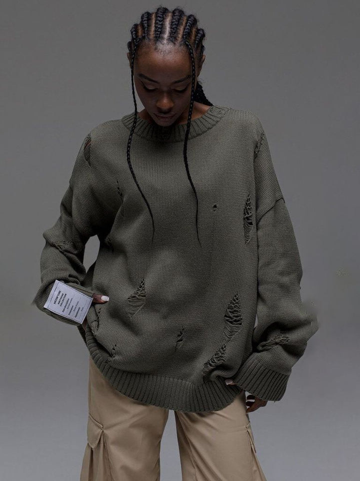 Kvinnors chunky stickad oversized tröja med slitna detaljer Mirla-Eva Jonsson