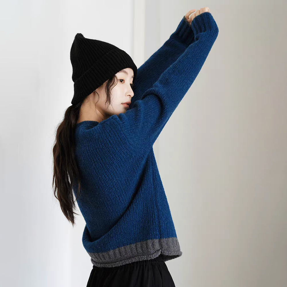 Kvinnors chunky stickad tröja med asymmetrisk krage och innovativ knappdetalj Mirla-Eva Jonsson