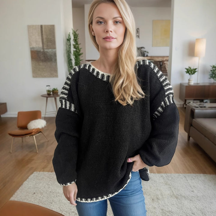 Kvinnors chunky stickad tröja med en avslappnad passform och randiga ärmar Mirla-Eva Jonsson