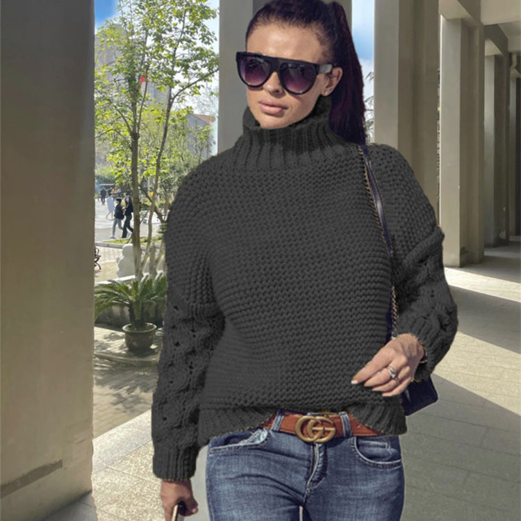Kvinnors chunky stickad tröja med hög krage och strukturerad sömsyn Mirla-Eva Jonsson