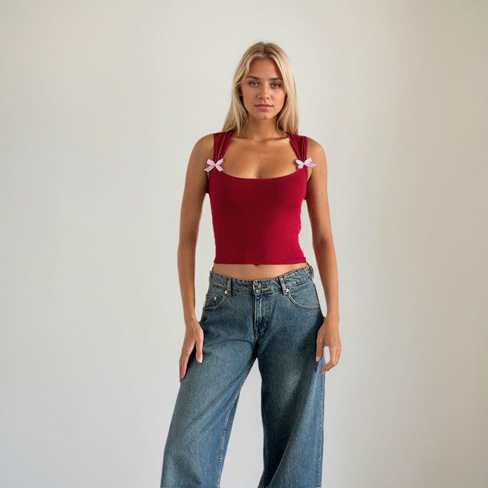 Kvinnors crop top med justerbara spagetti axelband och lekfulla rosetter Mirla-Eva Jonsson