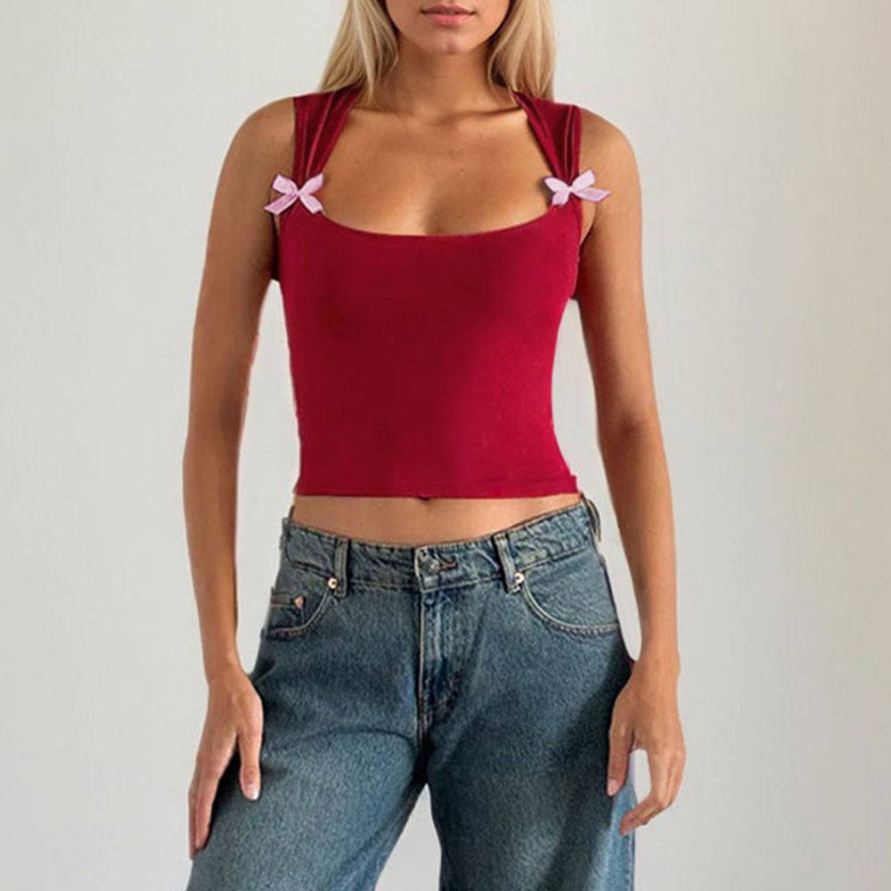 Kvinnors crop top med justerbara spagetti axelband och lekfulla rosetter Mirla-Eva Jonsson