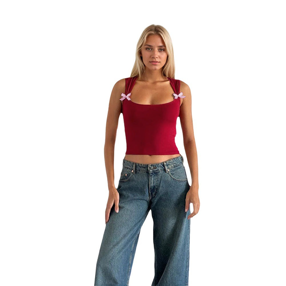 Kvinnors crop top med justerbara spagetti axelband och lekfulla rosetter Mirla-Eva Jonsson
